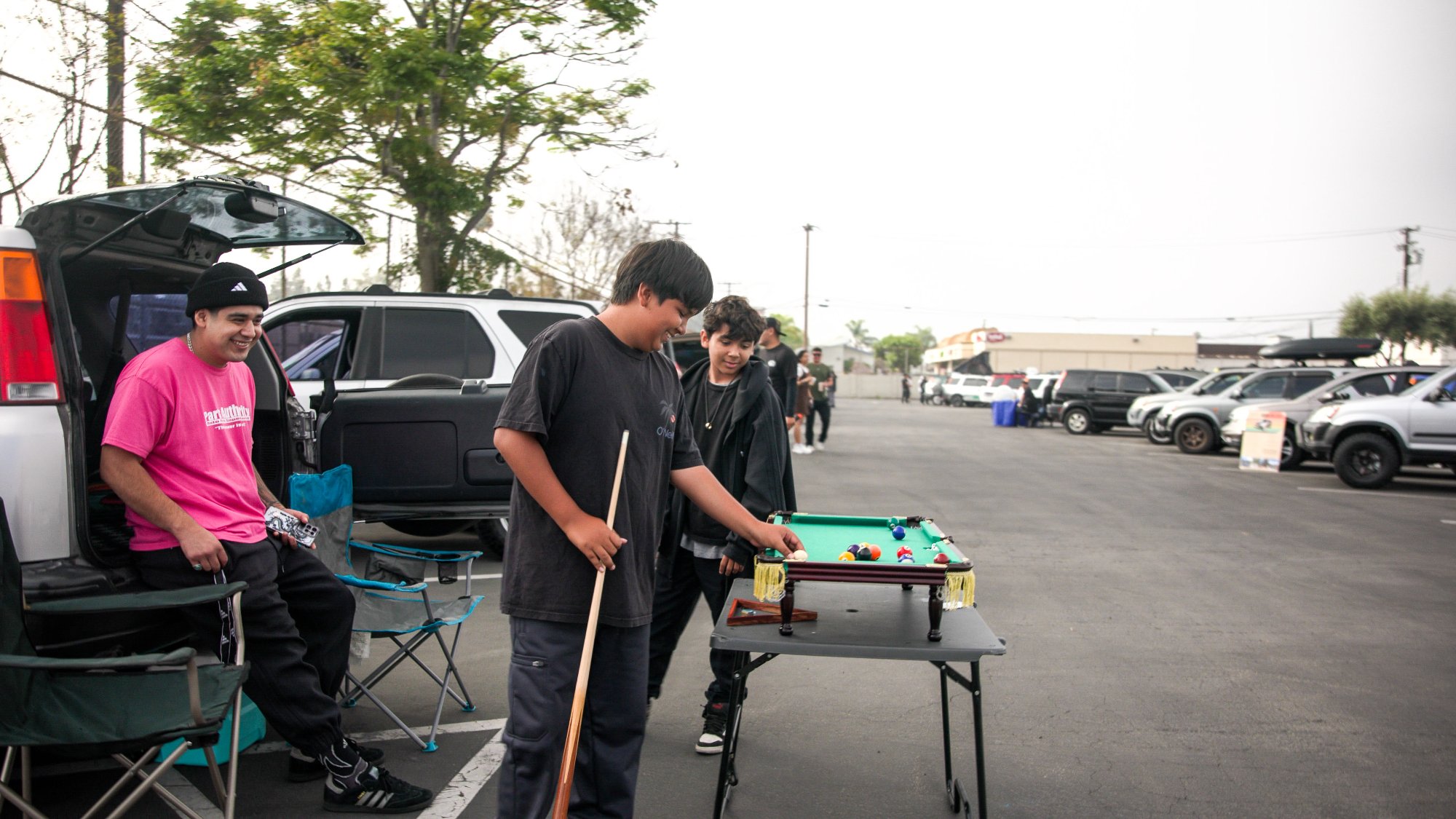 Kids playing pool in the lot